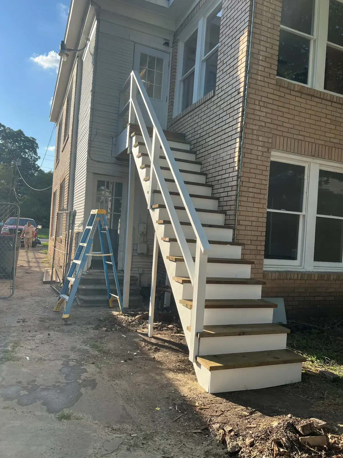 The same exterior staircase after being repaired and painted by RGS General Contracting