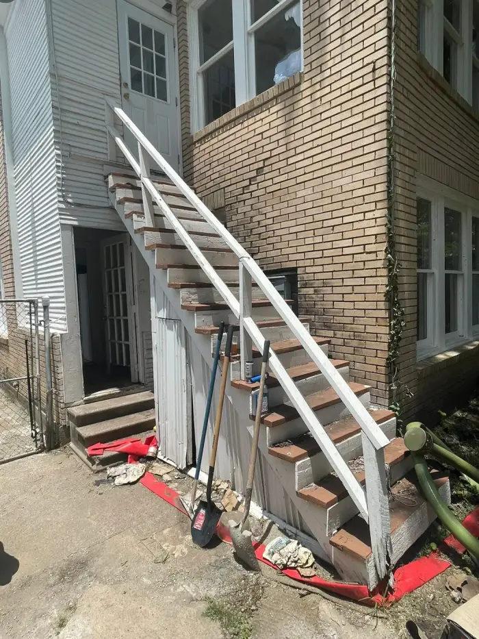 Completed exterior staircase with railing by RGS General Contracting